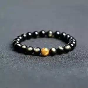 an amage of Obsidian Couple Bracelets with Golden Jade Bead