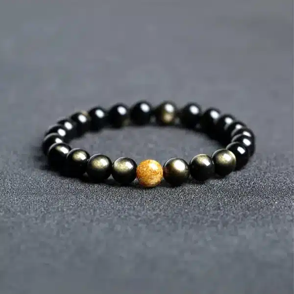 an amage of Obsidian Couple Bracelets with Golden Jade Bead