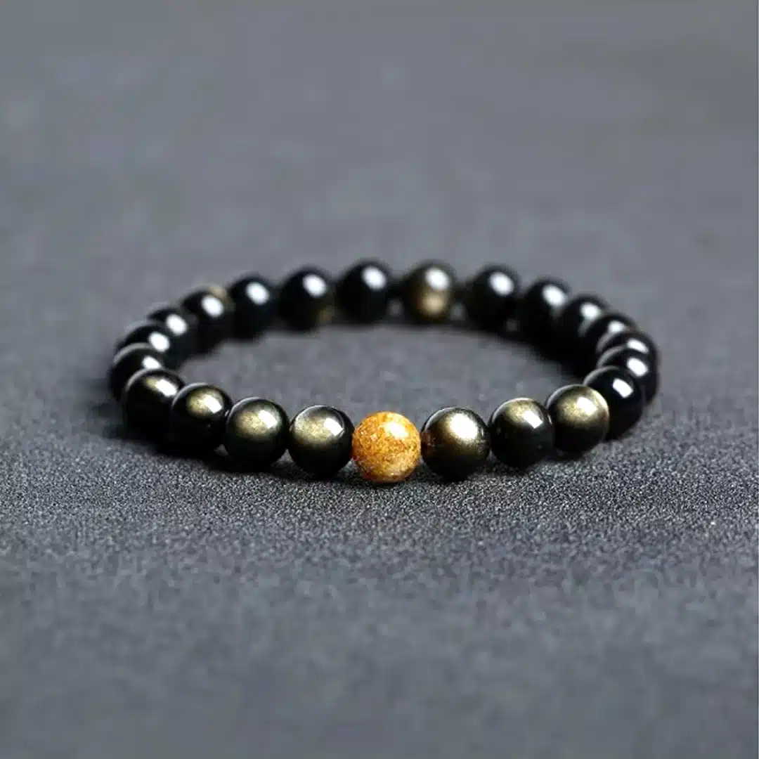 an amage of Obsidian Couple Bracelets with Golden Jade Bead