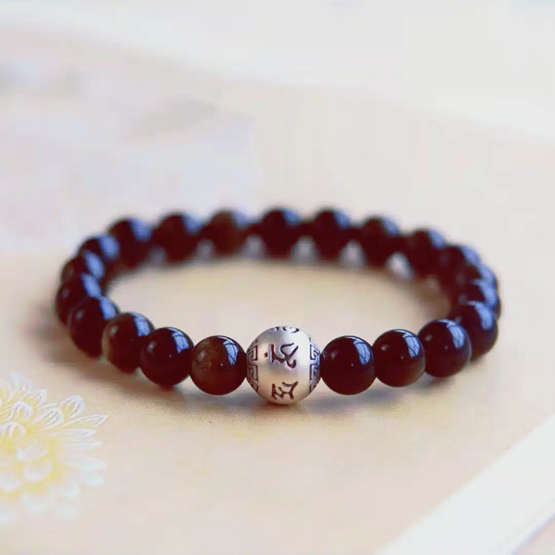an amage of Obsidian Bracelet with Sterling Silver Mantra Bead