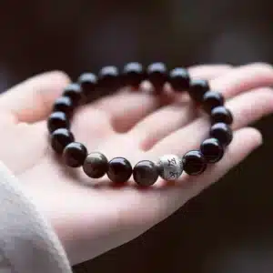 an amage of Obsidian Bracelet with Sterling Silver Mantra Bead