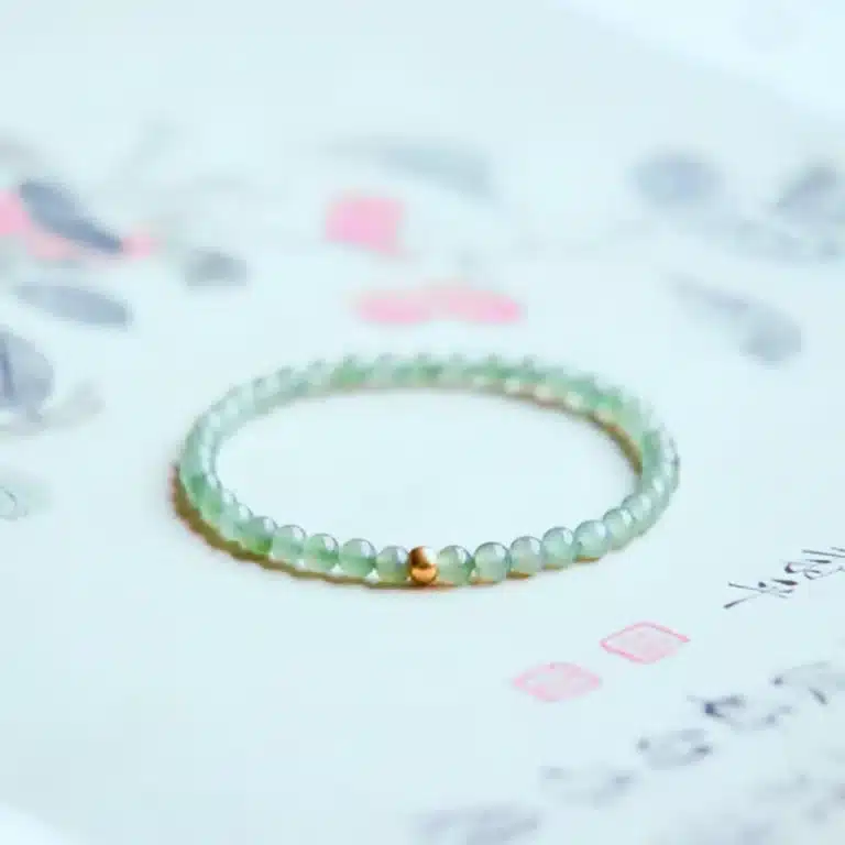 an amage of Elegant Hetian Jade Bracelet with Gold Lucky Beads