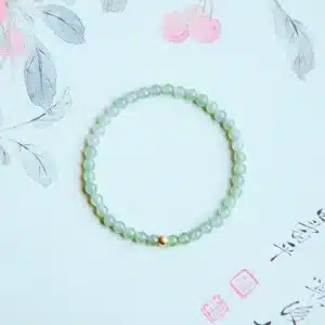 an amage of Elegant Hetian Jade Bracelet with Gold Lucky Beads