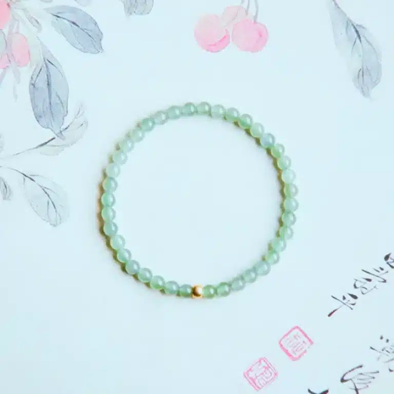 an amage of Elegant Hetian Jade Bracelet with Gold Lucky Beads